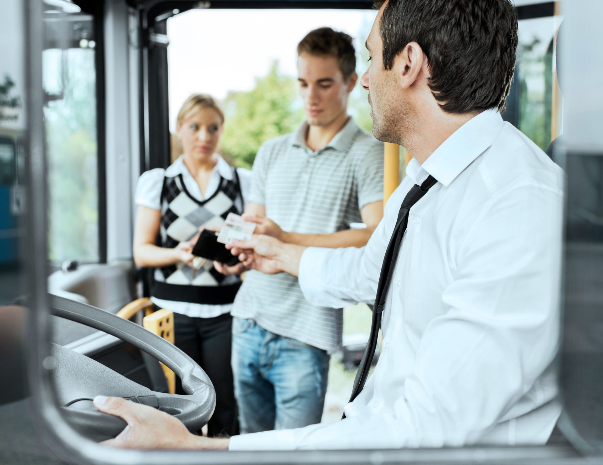 People paying bus fares.