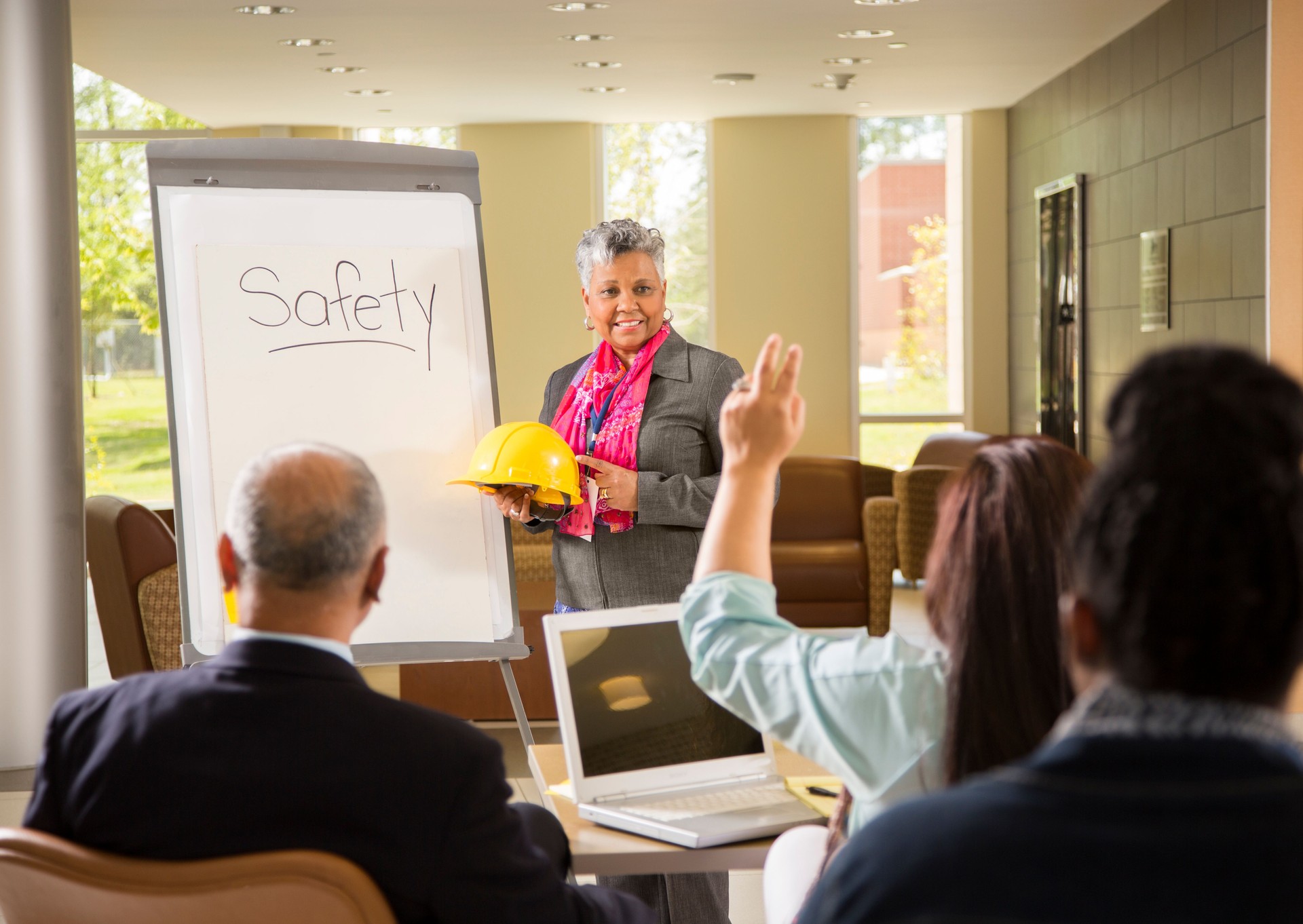 Safety in the workplace. Presentation with workers.